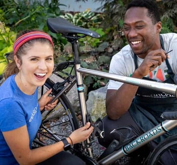 Backroads Travel Leaders working on bicycle 