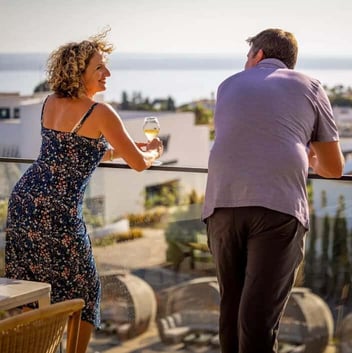 Backroads couple standing relaxing and drinking wine 
