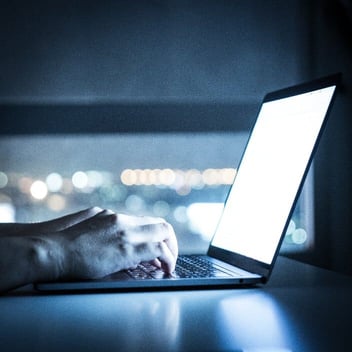 Glow from laptop screen nighttime 