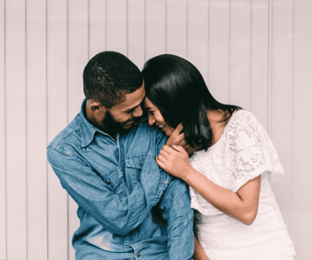Sunshine City Counseling couple cuddling together and laughing Sunshine City Counseling couple cuddling together and laughing