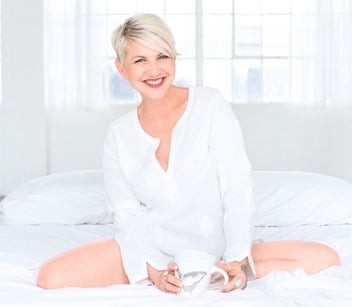 Zoë Kors wearing white on bed photo Zoë Kors wearing white on bed photo
