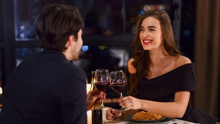 Introductions, Inc. couple at dinner date wine