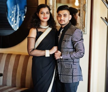 Photo of a male and female Indian couple posing for a portrait