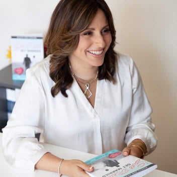 Photo of Aleeza Ben Shalom smiling and holding up her book Photo of Aleeza Ben Shalom smiling and holding up her book