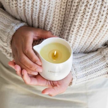 Photo of Naturally London massage candle being cradled in a woman's hands Photo of Naturally London massage candle being cradled in a woman's hands
