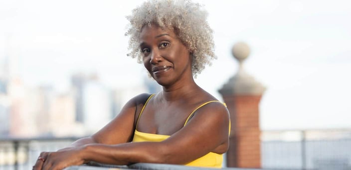 Older woman smirking at camera