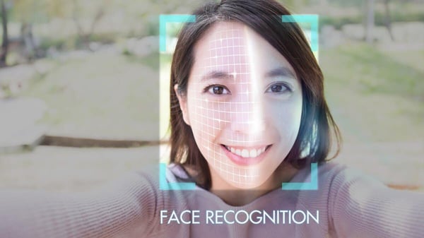 Woman completing a facial recognition scan as part of an identity verification and liveness check system used by dating apps. Woman completing a facial recognition scan as part of an identity verification and liveness check system used by dating apps.