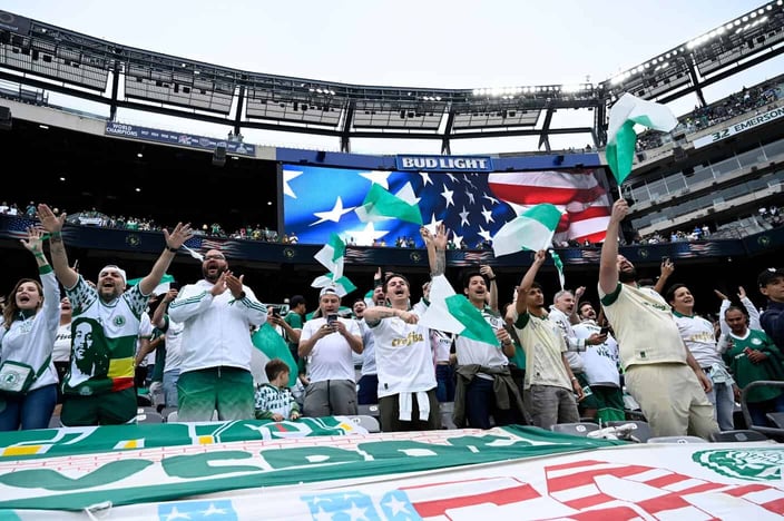Soccer fans wave flags and celebrate in the stands during a FIFA Club World Cup match at MetLife Stadium. Soccer fans wave flags and celebrate in the stands during a FIFA Club World Cup match at MetLife Stadium.