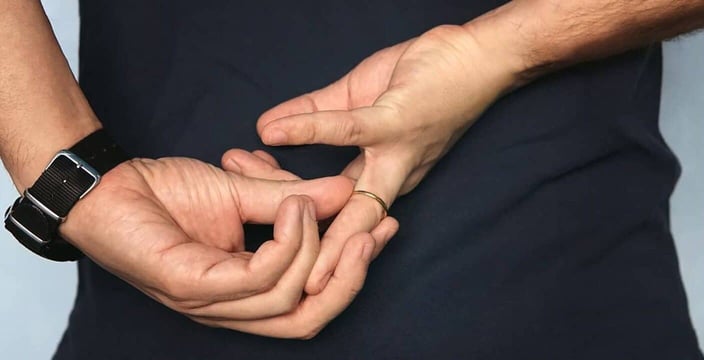 Photo of a man taking off his ring Photo of a man taking off his ring