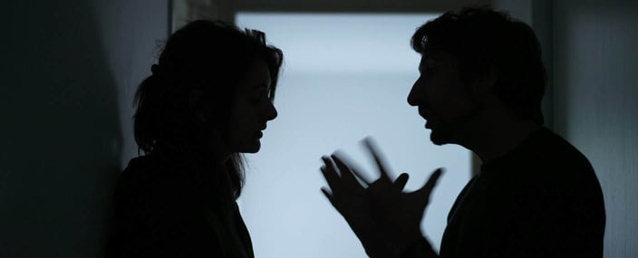 man and woman in shadow have argument man and woman in shadow have argument