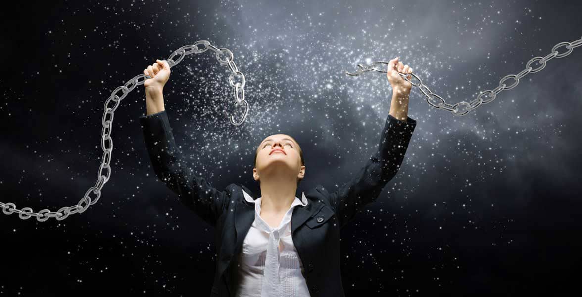 Photo of a woman breaking chains Photo of a woman breaking chains