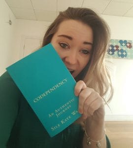 Photo of Sile Walsh with one of her books